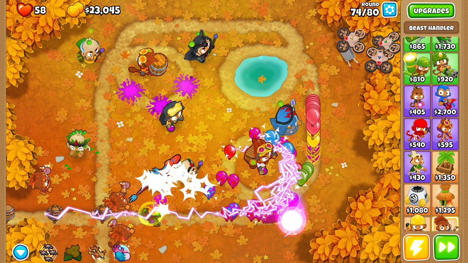 Monkey towers using ice, lightning, and other attacks against Bloons on an autumn-colored map in Bloons TD 6.
