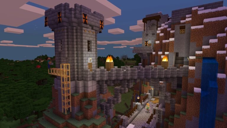 Construção de pedra em Minecraft possui torre, ponte iluminada, passagem inferior e cascata ao lado de uma montanha.